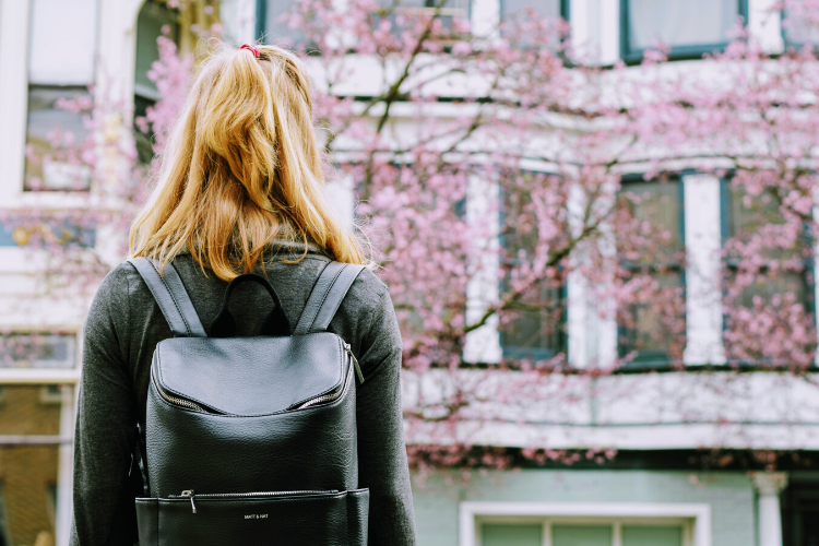 woman in front of flowered tree